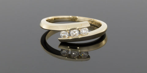 .25CTW Three Round Diamonds Bypass Ring