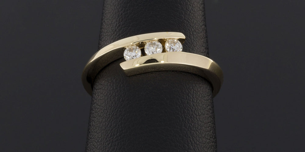 .25CTW Three Round Diamonds Bypass Ring