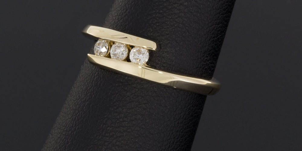 .25CTW Three Round Diamonds Bypass Ring